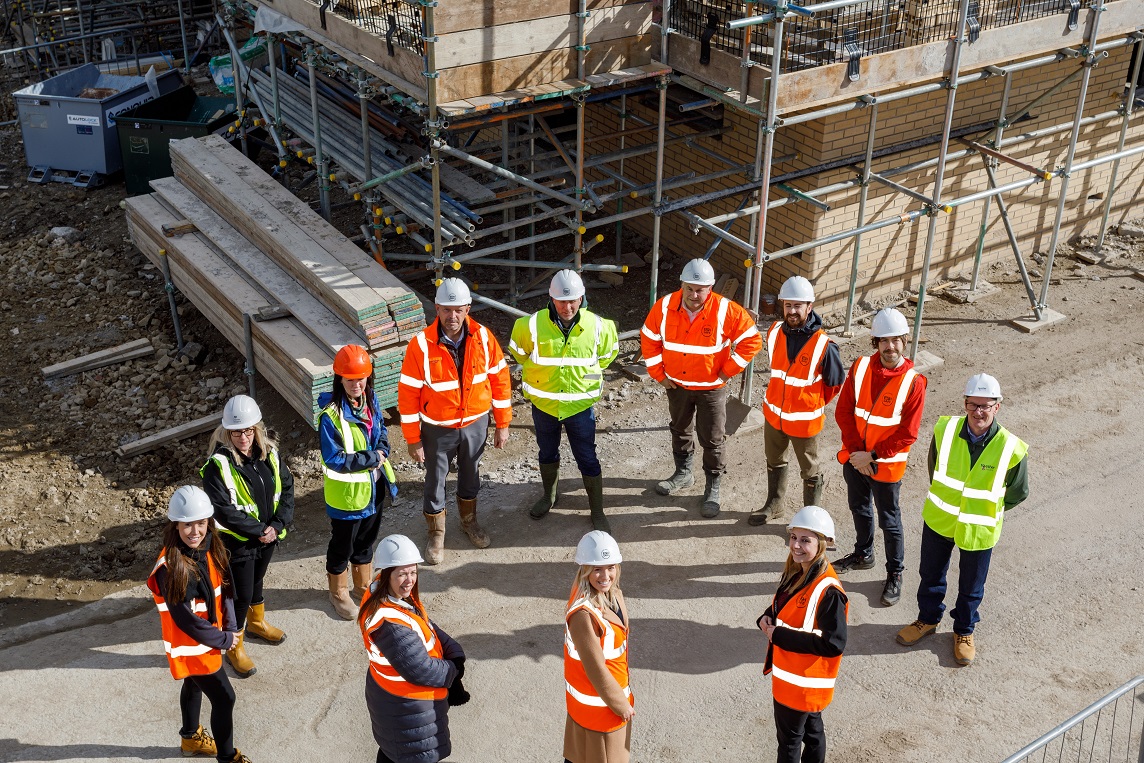 A group of engineers standing in a circle