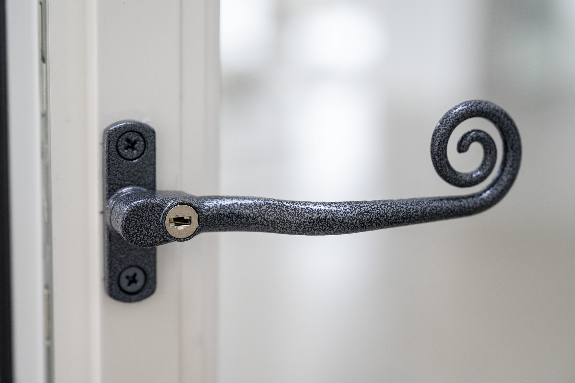 A Rehau Monkey Tail heritage window handle