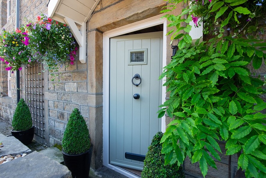 A mint green timber cottage door