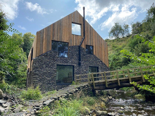 Converted Milll nestled under a cliff in Cumbria