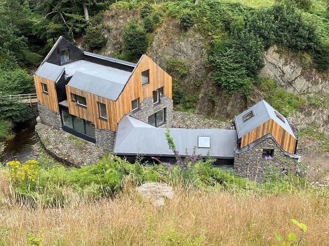 Converted Milll nestled under a cliff in Cumbria