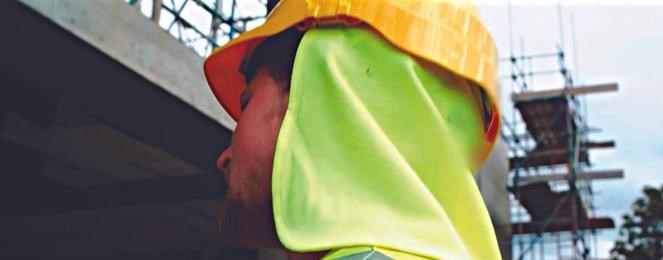 A man wearing neck protection in the sun